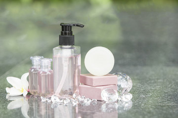 Shampoo and soap bars on light background. Personal care product