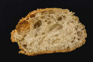 fluffy white bread isolated on black background