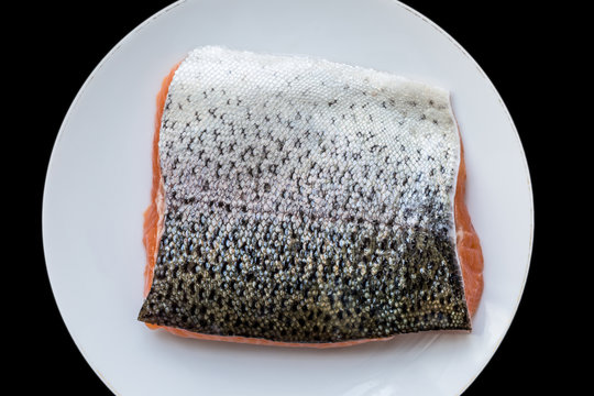 Fresh Salmon Fillet With Silver Skin Glittering Scales On White