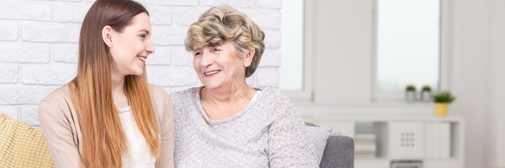 Granddaughter and grandmother laughing together