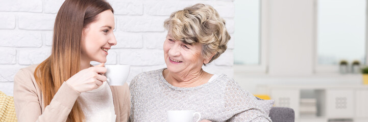 Girl and intergenerational talks with grandmother