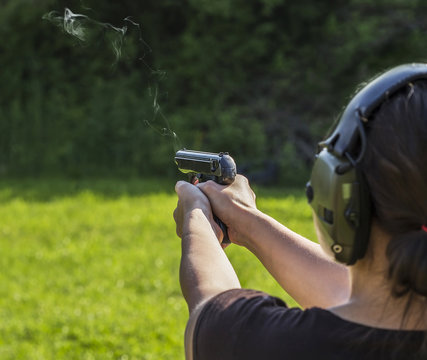 Girl shooting with a gun
