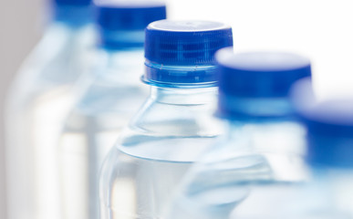 close up of plastic bottles with drinking water