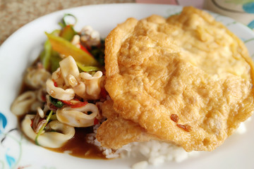 Seasoned squid fried food spicy basil fried egg topping