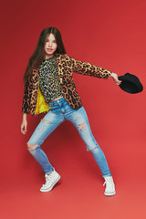 young teenage-girl dancing in laserbeam-discolight