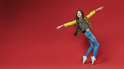 young teenage-girl dancing in laserbeam-discolight