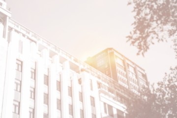 Fototapeta premium Bottom-up view of building with bright light
