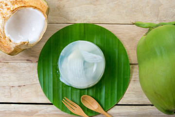 coconut jelly and wooden spoon on wooden background