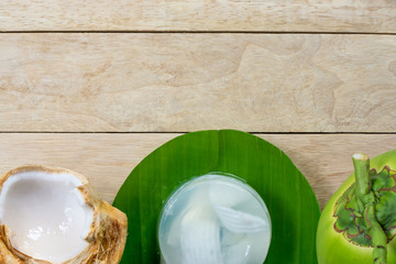 coconut jelly and wooden spoon on wooden background