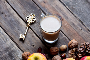 apples, fir-cones, cup of coffee, key and nuts