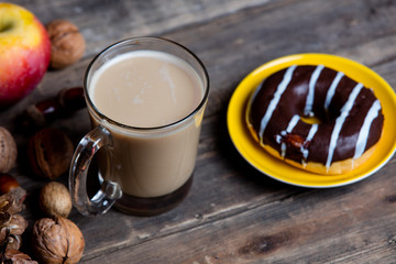 apples, fir-cones, cup of coffee, donut and nuts
