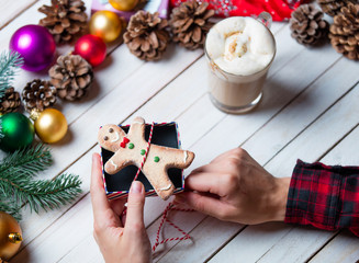 female hands wrapping a cookie