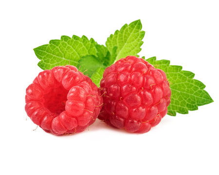 Raspberries with mint leaf. Closeup.