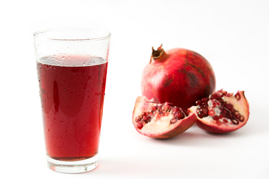 Pomegranate juice isolated on white background

