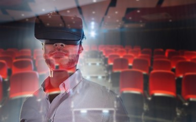 Composite image of businessman using an oculus
