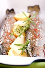 Sprig of rosemary between two trouts