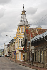 Fototapeta premium Old wooden houses in small street corner. Rakvere, Estonia.