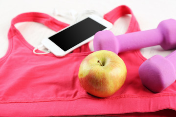 Sport clothes and equipment on wooden background