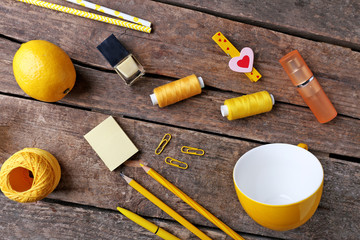 Yellow colour flat lay composition on wooden background