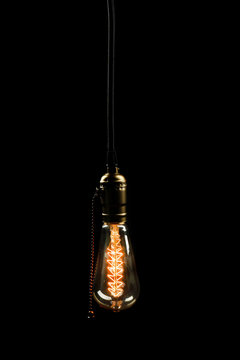 Light bulb on black background, close up