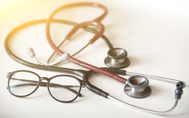 Stethoscope  and glasses with warm light