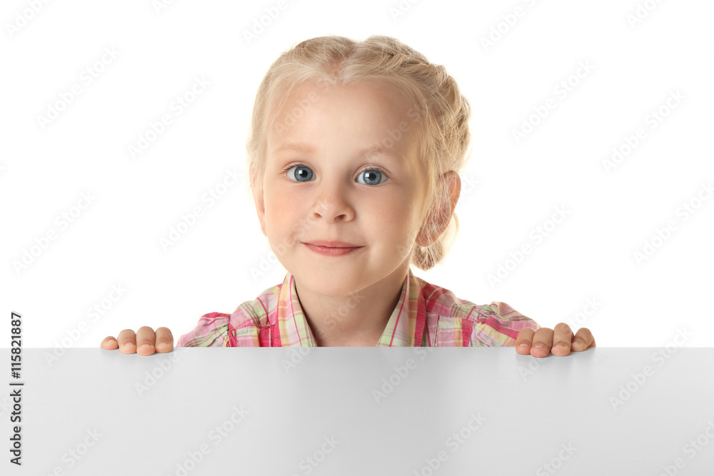 Poster Funny little girl standing behind white table