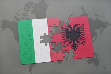 puzzle with the national flag of italy and albania on a world map background.