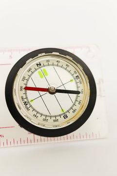 Detail shot of a glass compass on white background