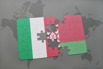 puzzle with the national flag of italy and belarus on a world map background.