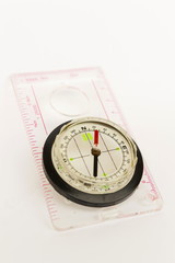 Detail shot of a glass compass on white background
