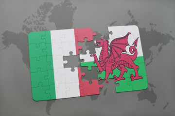 puzzle with the national flag of italy and wales on a world map background.