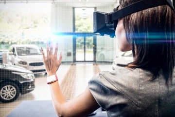 Composite image of woman using a virtual reality device