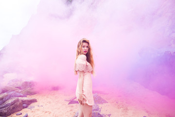 Girl surrounded by pink smoke