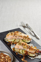 salmon fillet with lemon slices and savory