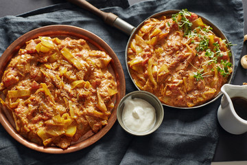 home-made indian cabbage stew with tomatoes decorated of watecre