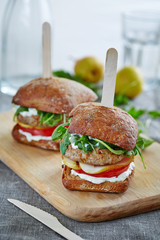 a pair of sliders on the cutting board