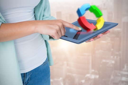 Composite image of woman using tablet pc 