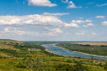Fototapeta na wymiar Panoramic View on river from hill in mid day