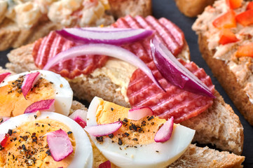 Mix of sandwiches on a stone board
