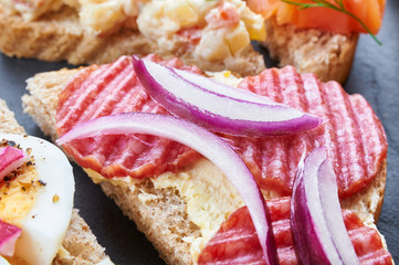 Mix of sandwiches on a stone board