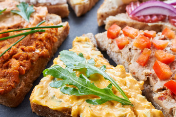 Mix of sandwiches on a stone board