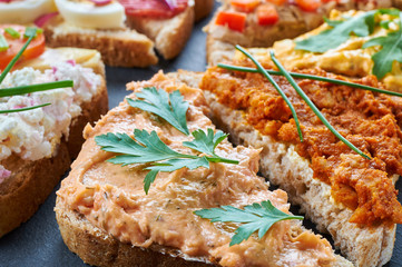 Mix of sandwiches on a stone board
