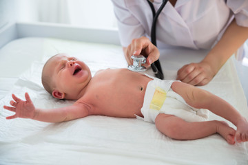 Doctor Listening To Baby's Heart Beat