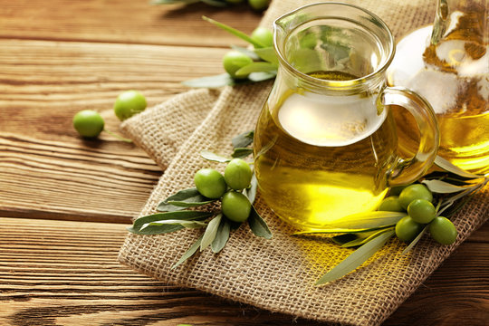 olive oil bottles on wooden table