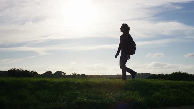 4K Walking male stops to enjoy the view