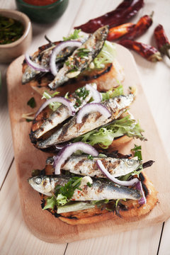 Italian crostini sandwich with grilled sardine fish