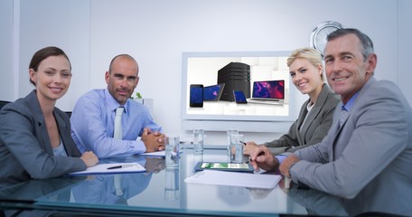 Obraz premium Composite image of business team looking at white screen