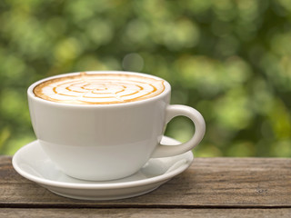 Coffee cup on wooden table ,soft focus


