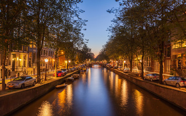 Canal of Amsterdam at twilight sunset