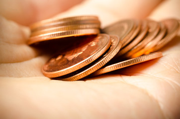 Heap of coins in hand,saving money concept